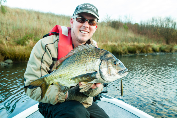 Fisho's Scott Thomas filming Bushy talking about Squidgy's new prawn lures.